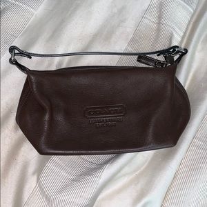 Brown coach mini purse.